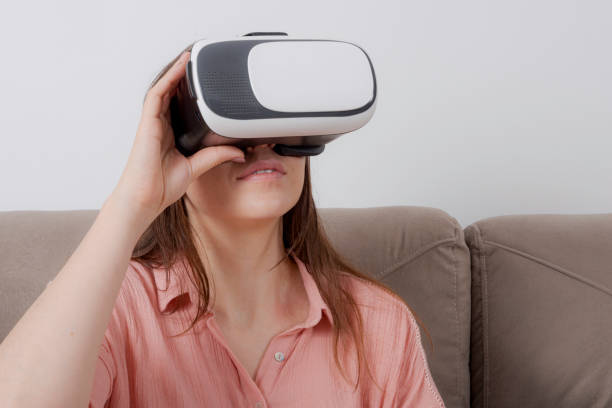 istock Beautiful woman looking with VR device and feeling excited 1172806181
