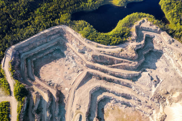 Large granite quarry in the woodland aerial view Industrial landscape with large granite quarry in the woodland aerial view nature russia environmental conservation mineral stock pictures, royalty-free photos & images