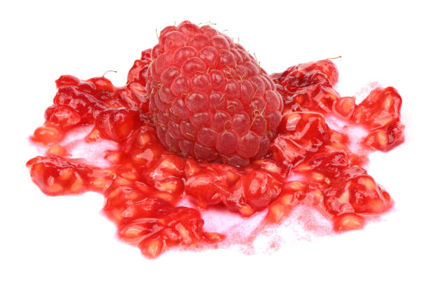 Smashed raspberries isolated on white. Smashed raspberries isolated on white background. High resolution photo. Full depth of field. strawberry crush stock pictures, royalty-free photos & images