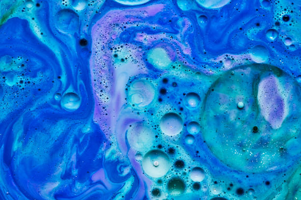 istock mixing blue white and purple color paints on blue background 1172810025