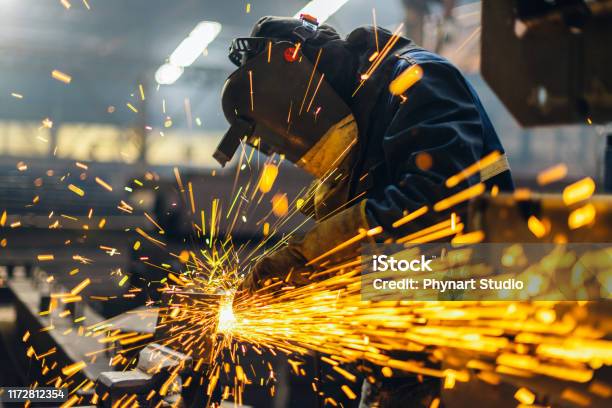 Metal Worker Using A Grinder Stock Photo - Download Image Now - Manufacturing, Welder, Industry