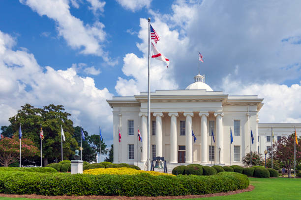 istock Montgomery Alabama State Capitol building with columns, steps,  Dome, flags, a Liberty Bell replica,  and beautiful landscaping 1172812468