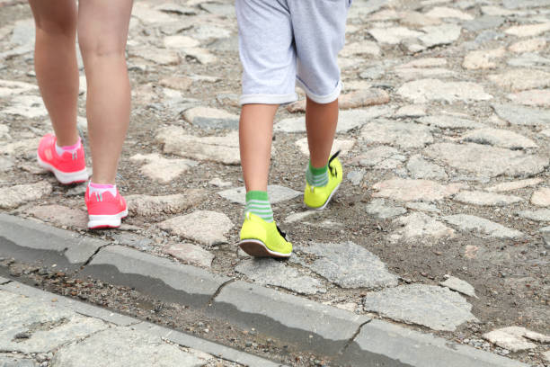 istock legs go along the road 1172812755