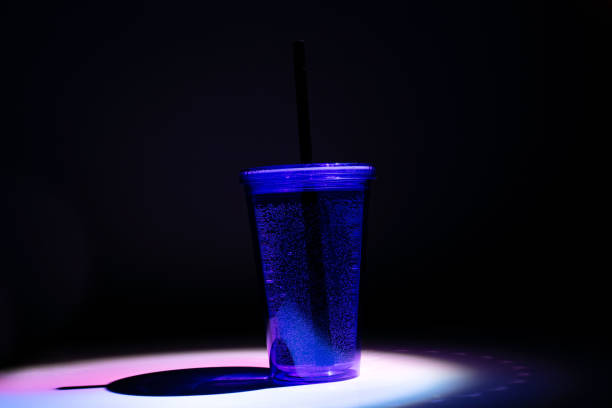 istock Cocktail glass, drinks in plastic cup with black straw 1172818486