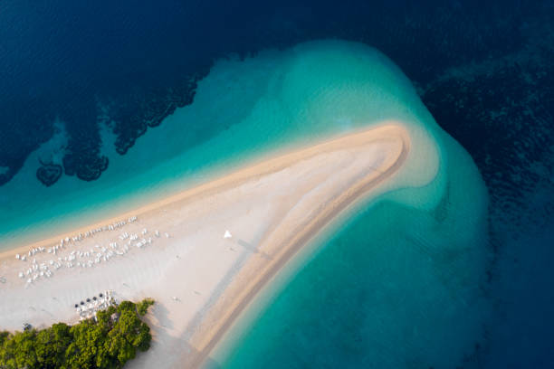 Aerial view of Zlatni Rat, Golden Cape, Brac Island, Croatia. Top view on summer beach travel in Adriatic Sea. Drone photo. Traveling concept. Aerial view of Zlatni Rat, Golden Cape, Brac Island, Croatia. Top view on summer beach travel in Adriatic Sea. Drone photo. Traveling concept. hvar photos stock pictures, royalty-free photos & images