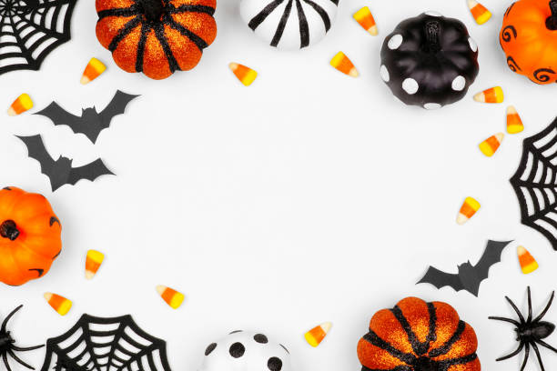 istock Halloween frame flat lay of pumpkins, candy and decor, over a white background 1172823614