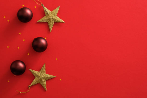 istock Christmas ornaments decorations on red background with copy space. Flat lay red baubles balls, golden stars, glitter confetti. Christmas cover mockup, greeting card template, social media Xmas banner 1172826961