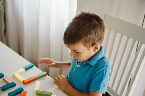 Cute little boy having fun at home.