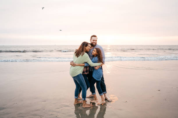 istock Sunset at the beach with family 1172836086