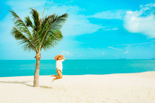 istock Woman at tropical beach 1172836703