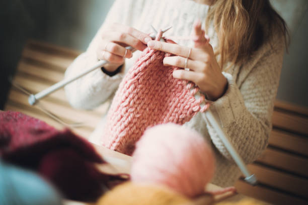 istock Close up on woman's hands knitting 1172836800
