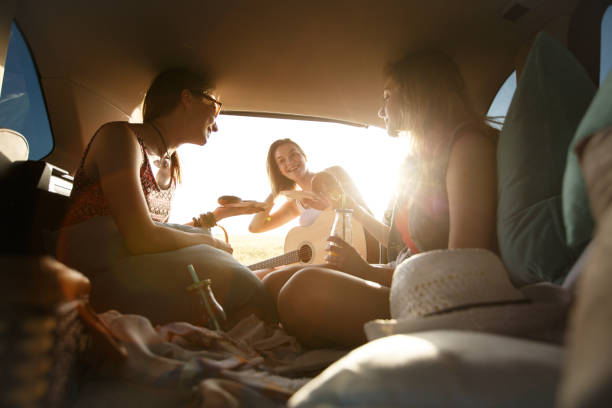 istock Happy group of friends having fun while glamping 1172836815