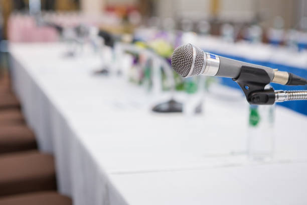 istock Selective focus of microphone in the seminar room on blurred background 1172840845