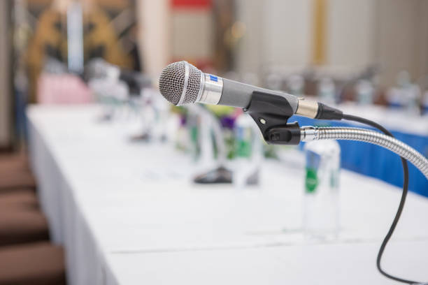 istock Selective focus of microphone in the seminar room on blurred background 1172840864