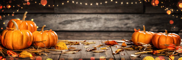 istock Thanksgiving Pumpkins And Leaves On Rustic Wooden Table 1172841138