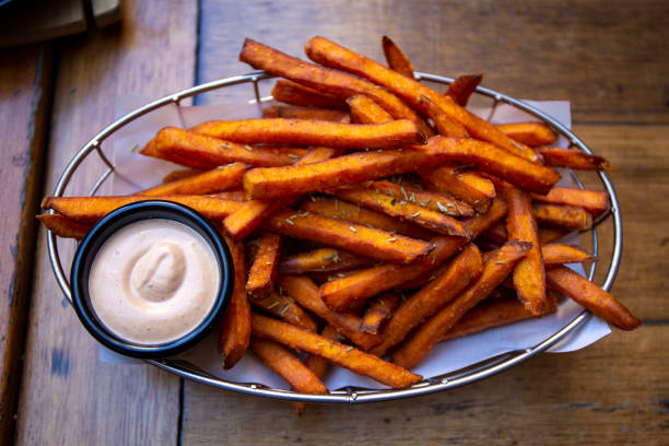 sweet potato fries Sweet Potato Fries with dipping sauces sweet potato french fries stock pictures, royalty-free photos & images