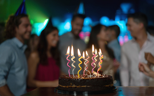 Close-up on a cake in a birthday party at the nightclub - celebration concepts