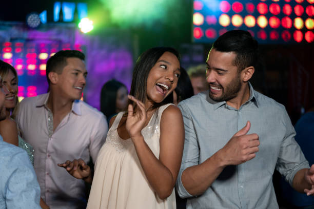 istock Black couple having fun dancing at a nightclub 1172845436