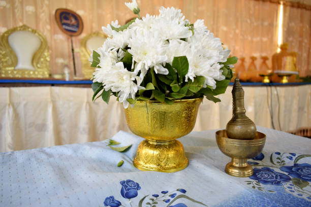 istock White flower in golden pan 1172846300