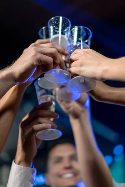 istock People at the nightclub making a toast 1172846330