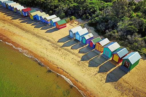 Reflections from an aerial view of beach houses on a sunny day