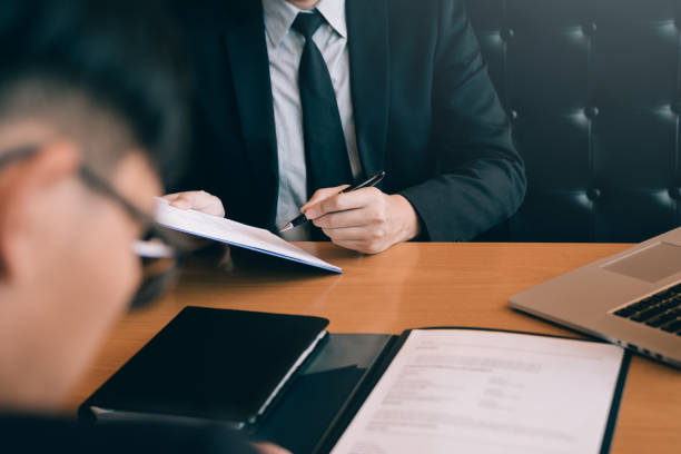 istock Confident caucasian manager interviews talking with a client prospective male employee. 1172847311