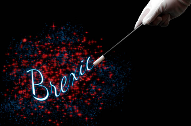 Great Britain leaving the EU is a magic trick concept theme with magician hand wearing white gloves and witting with a wand the word Brexit surrounded by pixie dust