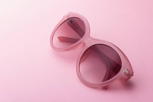 istock Classic retro style pink sunglasses closeup on pink background 1172875022