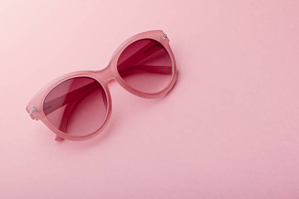 istock Classic oval oversized pink sunglasses closeup on pink background 1172875026