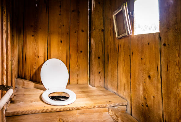 old wooden outhouse indoors an old wooden outhouse outhouse interior stock pictures, royalty-free photos & images