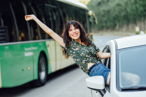 istock Young woman, wearing flowered dress, between trees. 1172882025