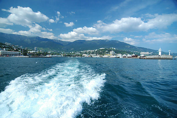 Crimean coast of Ukraine. Leaving Yalta Harbor by small boat across the Black Sea.