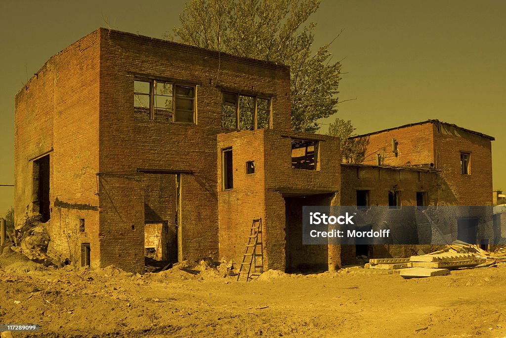 Abandoned Factory Buildings in yellow Abandoned Factory Buildings in Moscow. Old steel concrete products factory. Abandoned Stock Photo