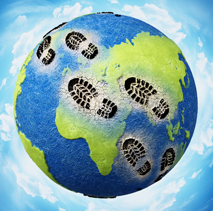 Black boots footprints on the globe harming continents and seas.\nAdobe Illustrator and Photoshop used for world texture map modifications. Original texture link: https://eoimages.gsfc.nasa.gov/images/imagerecords/73000/73580/world.topo.bathy.200401.3x5400x2700.jpg