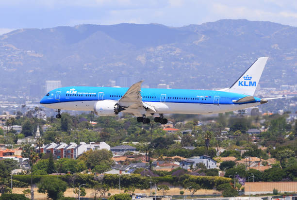 KLM 787 lands on Runway (LAX) Los Angeles, California, USA - May 22, 2019: A KLM Boeing 787 Dreamliner lands at the Los Angeles International Airport (LAX). In the background you can see hollywood. klm stock pictures, royalty-free photos & images