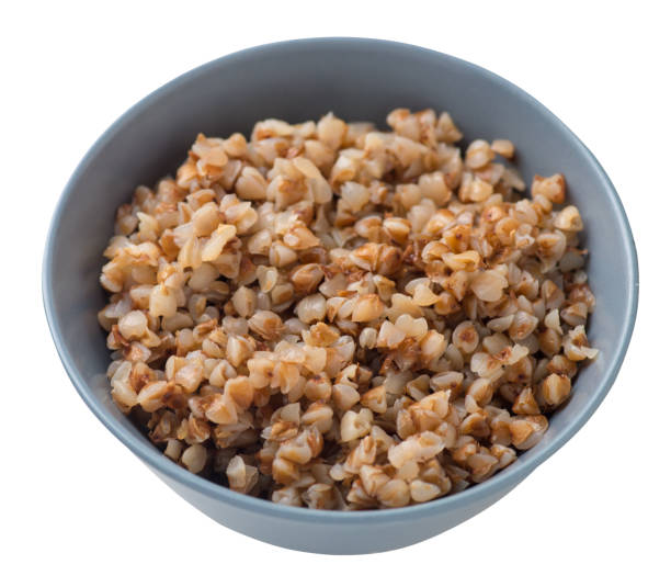 istock buckwheat in a plate isolated on white background. buckwheat top view. 1172903562