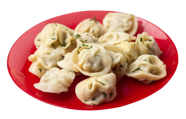 istock dumplings on a plate isolated on white background .meat dumplings top view . 1172903670