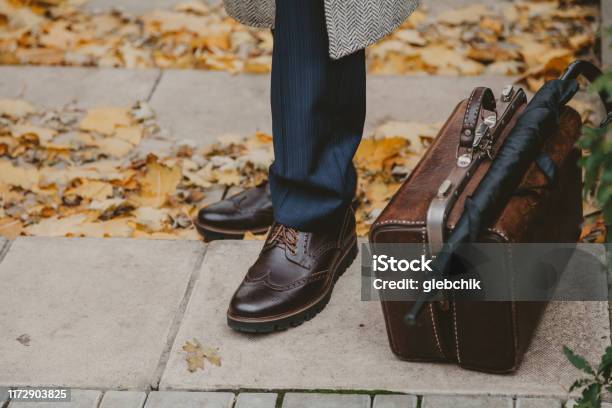 Legs Of Man And Carpetbag In Autumn Park Stock Photo - Download Image Now - Brogue, Shoe, Adult