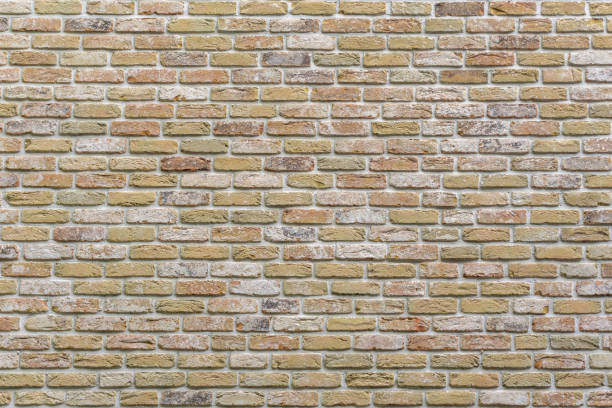 Vintage style yellow brick wall. Brick background stock photo