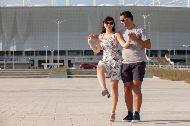 istock A young couple of dance instructors teaching salsa and bachata 1172907680
