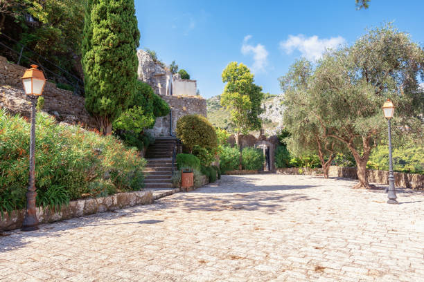 The entrence to the cemetery of the picturesque medieval French village of Eze The entrence to the cemetery of the picturesque medieval village of Eze in France entrence stock pictures, royalty-free photos & images