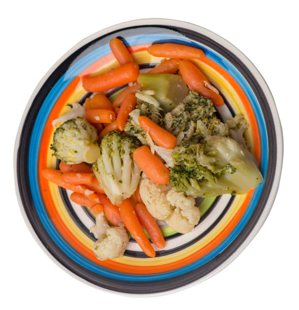 istock provencal vegetables on a plate.grilled vegetables on a plate isolated on white background.broccoli and carrots on a plate top view.healthy food 1172908552