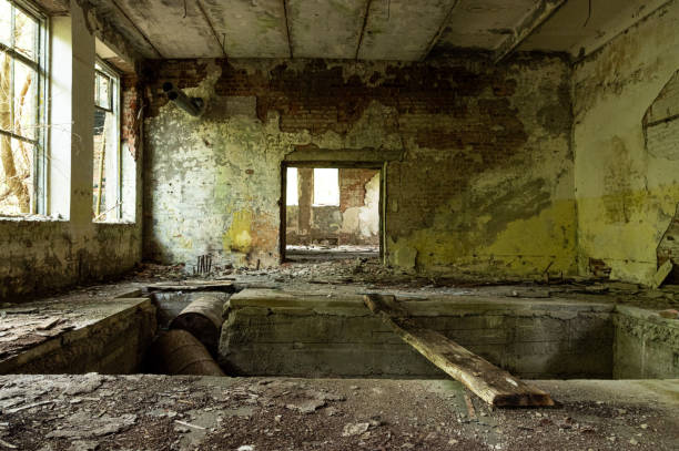 istock Old abandoned production halls. Broken walls and windows. 1172910590