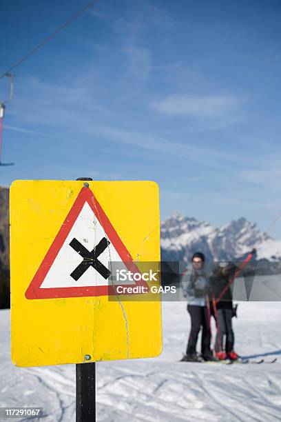 Warning Sign For Passing Skiers In A Ski Lift Stock Photo - Download Image Now - Crossing, Skiing, Cold Temperature