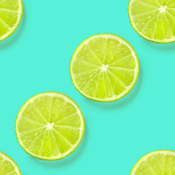 istock A seamless limes pattern on a vibrant teal blue background, a fruity citrus repeat print 1172910855