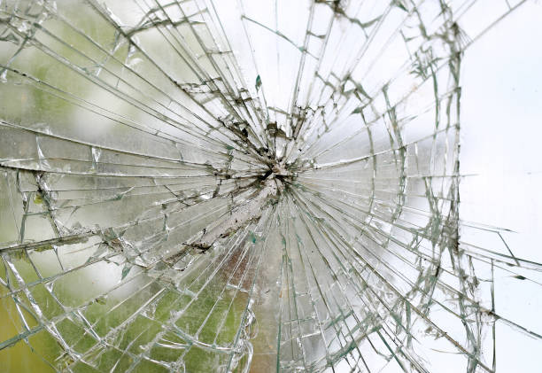 istock Old cracked dirty broken glass window background. 1172911994