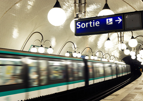 A Train of the Paris Metro crosses a station