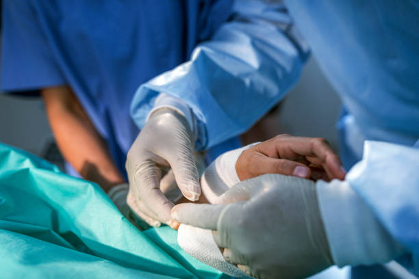 istock Doctor applying bandage on patient's hand 1172913164