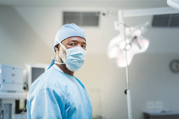 Confident doctor wearing surgical mask and cap