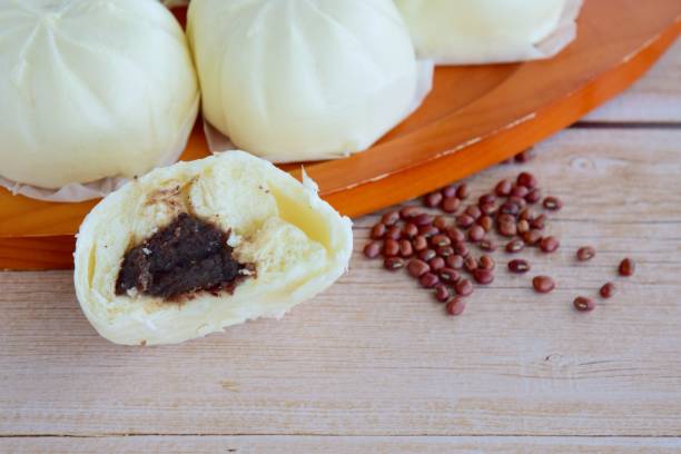 istock Asian steamed bun with adzuki red bean paste filling or Bakpao 1172915649